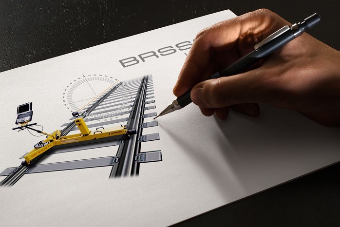 An image showing the final logo design for BROSSOS on a sketchpad with a persons hand holding a pencil on the right.